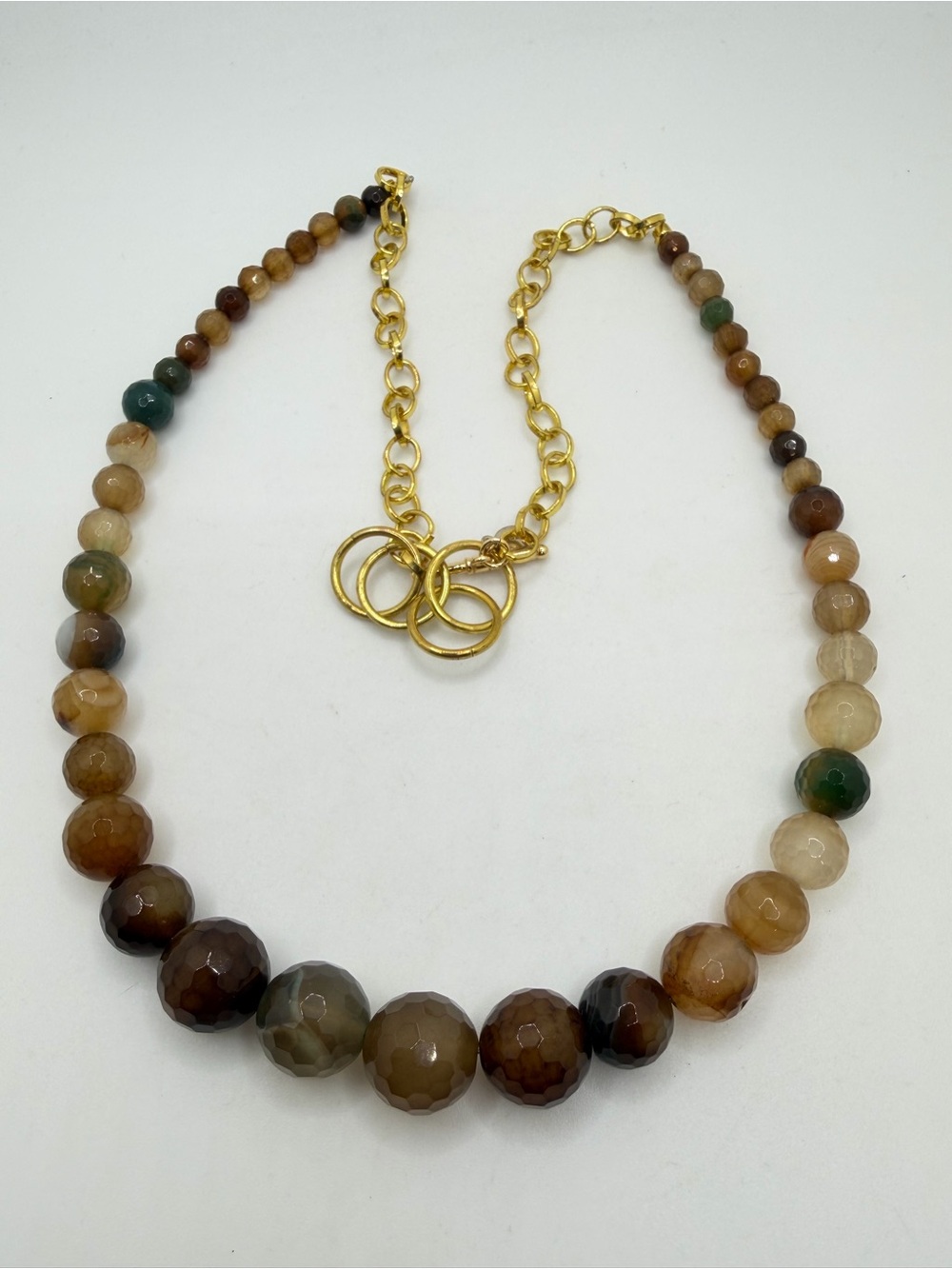22-24" Graduated, faceted brown agate necklace with‎ gold tone hardware!